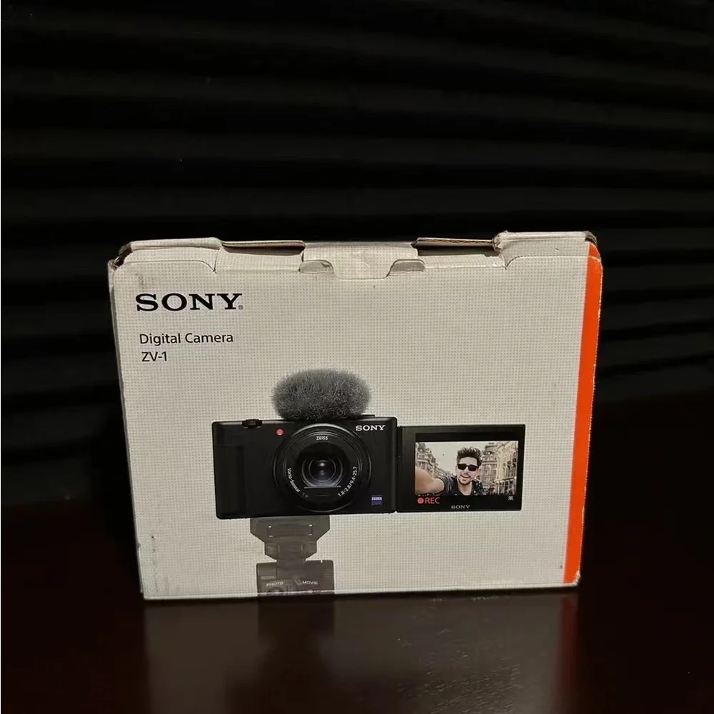 Sony Black Compact Camera with ZEISS Lens and Gray Wind Muff